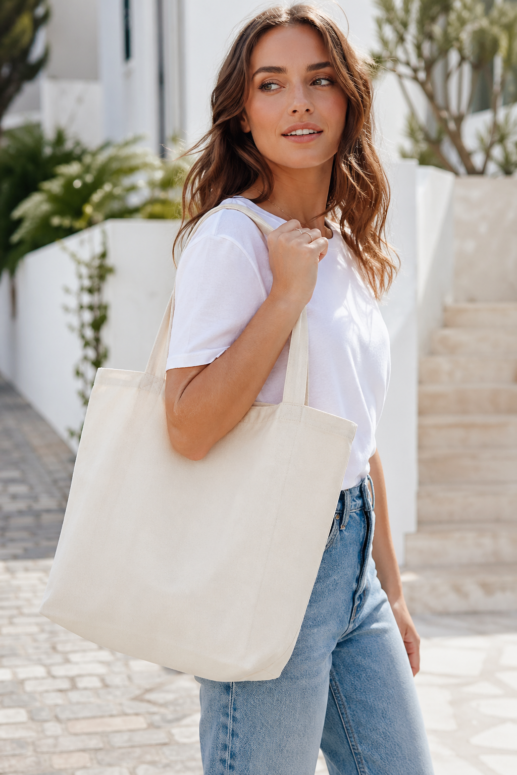 Woman carrying a natural canvas blank tote bag